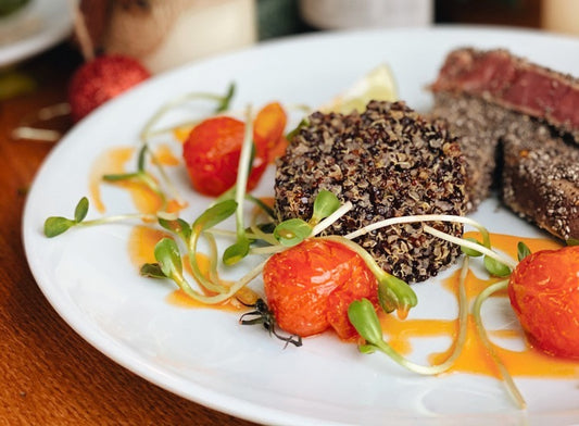 microgreens with quinoa on white plate